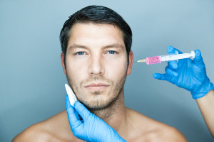 Male face, patient at Botox treatment