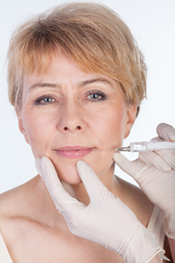 Female face at Dermal fillers injection process