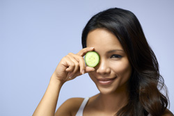 woman with cucumber photo