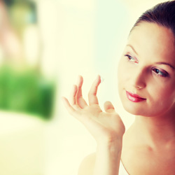 female using moisturizer photo