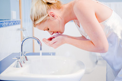 Woman washing face