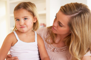 Chicken Pox Q&A: Female with child on hands