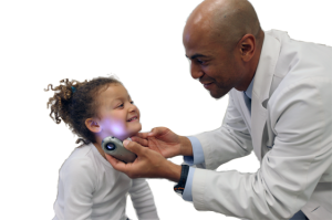 Doctor inspecting child