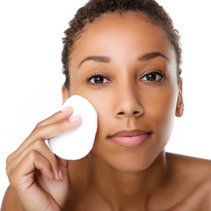 Woman cleaning face