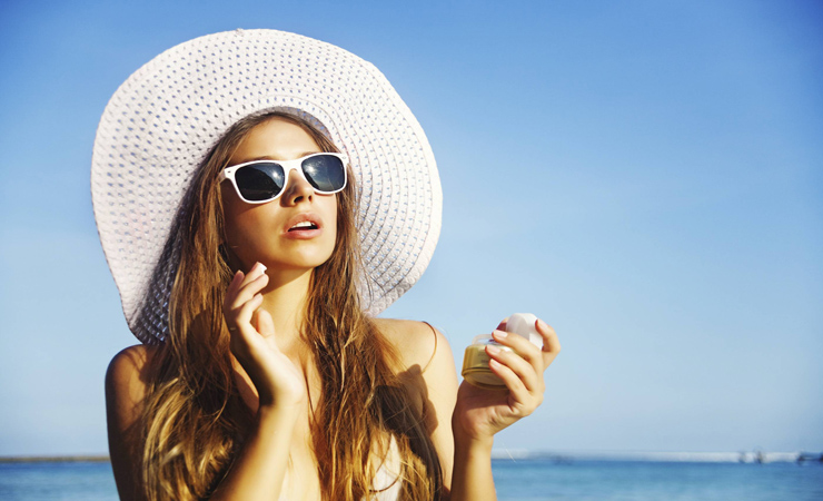 Avoid Sun Exposure (woman on the beach)
