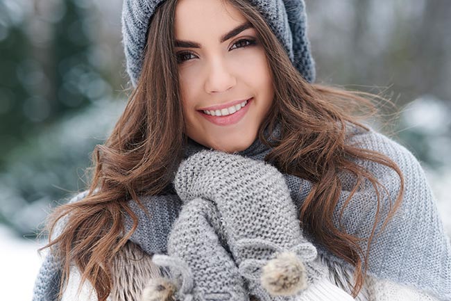 Smiling woman at the snow