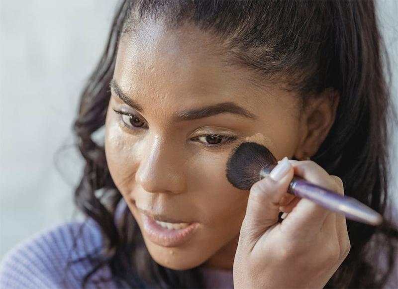 a person applying foundation