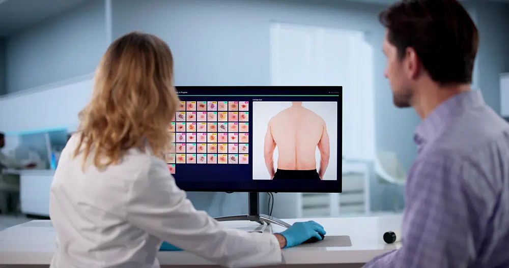 Doctor examining Skinmap Photos